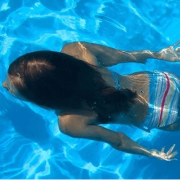 Woman in a swimming pool of a Barcelona hotel