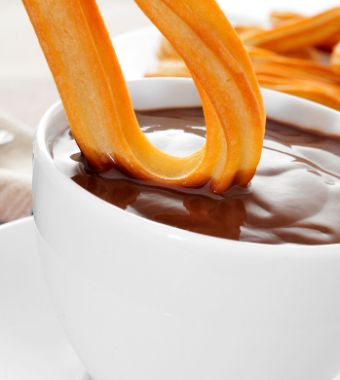 Hot Chocolate with churros, a classic of the best food tours in Barcelona