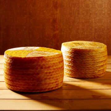 Wheels of Manchego cheese from Spain