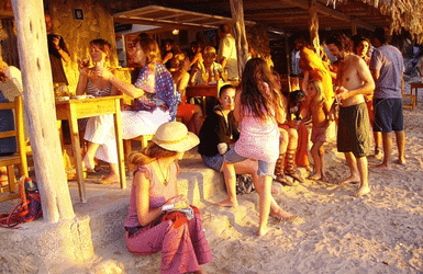 People in a beach club in Ibiza. Balearic Islands near Barcelona