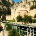 How to get to Montserrat (Spain)? By cable car, rack train or road. All three options show in this picture.