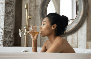 Woman relaxing at the bathtub of one of the best Barcelona luxury boutique hotels